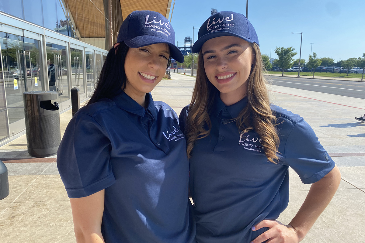 Two Polaris brand ambassadors in Live! Casino branded polos and caps at the South Philadelphia sports complex