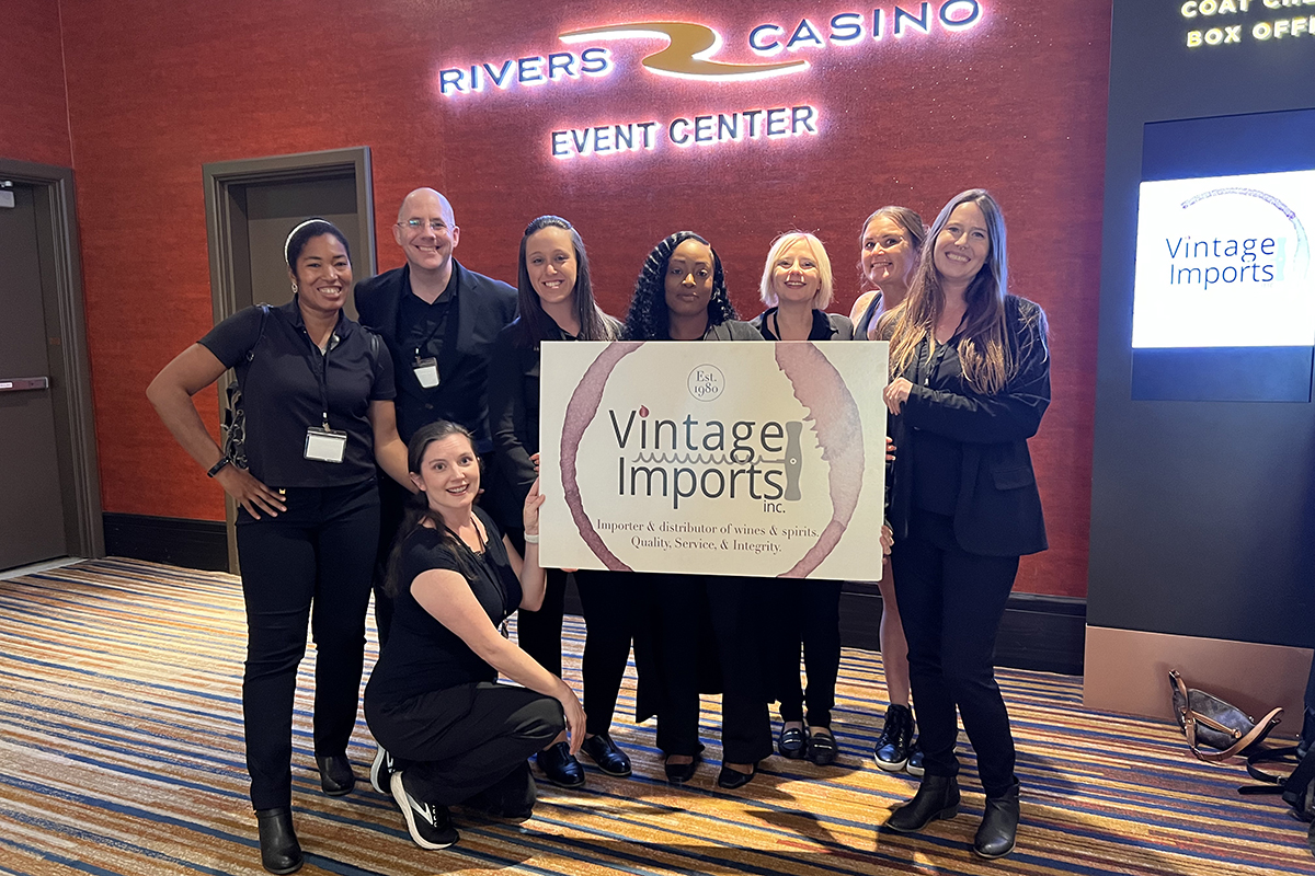 Polaris event staffing team with the Vintage Imports sign at the Rivers Casino Event Center buyer show